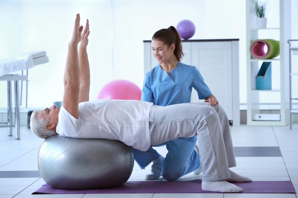 Physiotherapist,Working,With,Patient,In,Clinic Physiotherapist,Working,With,Patient,In,Clinic